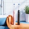 Bitvae Rotating Electric Toothbrush 2 Packs for Adults with Pressure Sensor, Gifts for MenWomen, 5 Modes Rechargeable Power Toothbrush with 8 Brush Heads, Black & Pink, R2